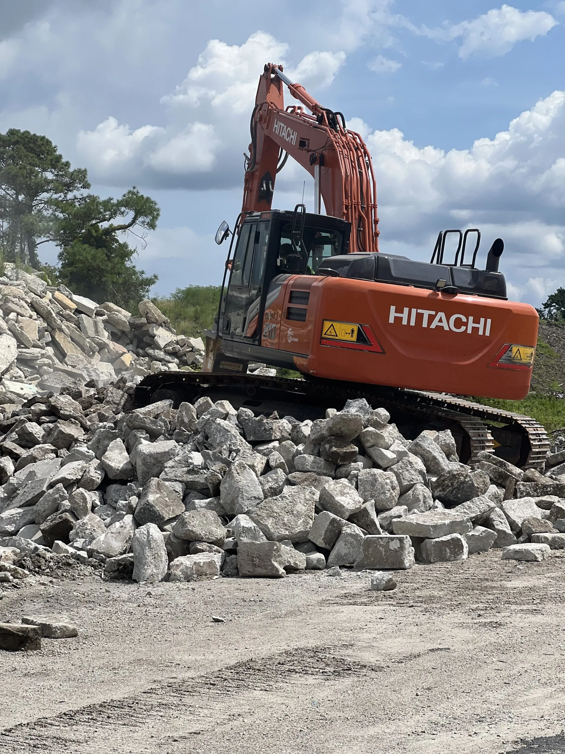 Excavator on Concrete Pile
